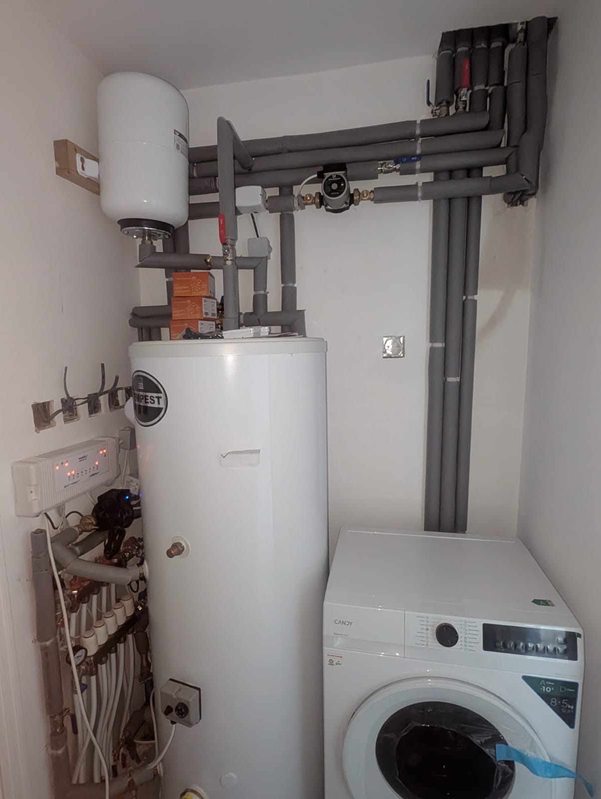 Unvented hot water cylinder and underfloor heating manifold installed in a Greenwich home